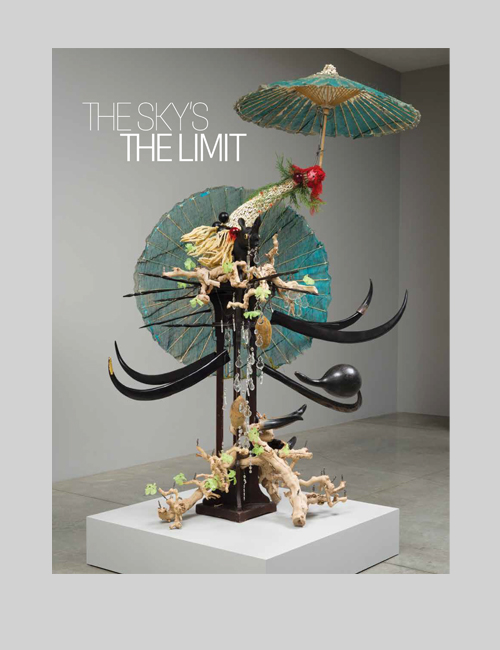 Cover displays a mixed media sculpture that evokes figures holding umbrellas.