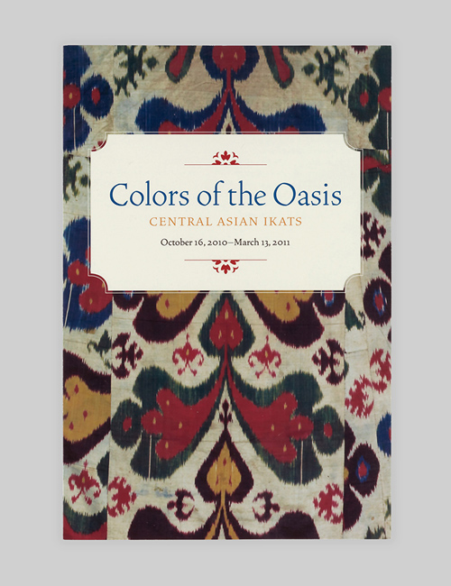 Cover of the Colors of the Oasis gallery guide displays the exhibition identity over a bright, multi-colored textile detail.